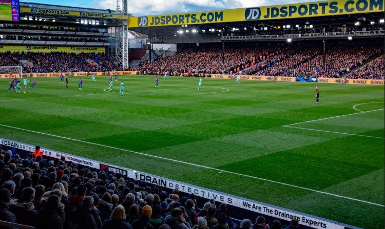Drain Detectives banner is seen from the Main Stand at Selhurst Park against Arsenal.
